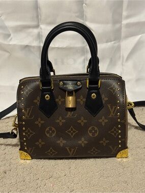 Beautiful trunk satchel in two tone monogram with gold accents
